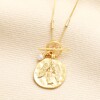 T-Bar Angel Coin Pendant Necklace in Gold on a neutral background