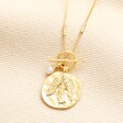 T-Bar Angel Coin Pendant Necklace in Gold on a neutral background