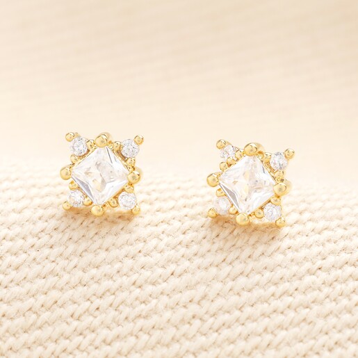 Close up Close up of Tiny Crystal Star Stud Earrings in Gold
