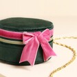 Close up of bow of jewellery case on a neutral background