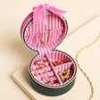 Green and Pink Velvet Bow Mini Round Jewellery Case opened on a neutral background