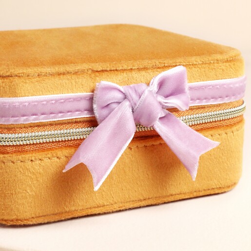 Close up of bow on the Mustard Square Travel Jewellery Case
