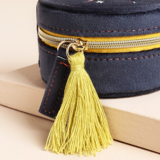 View of lime green tassel and zip