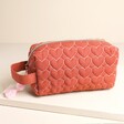 Rust Linen Heart Embroidered Makeup Bag on a neutral background