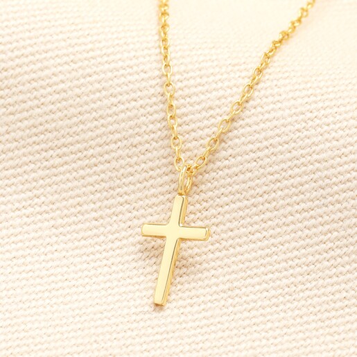 Sterling Silver Cross Necklace in Gold on a neutral background