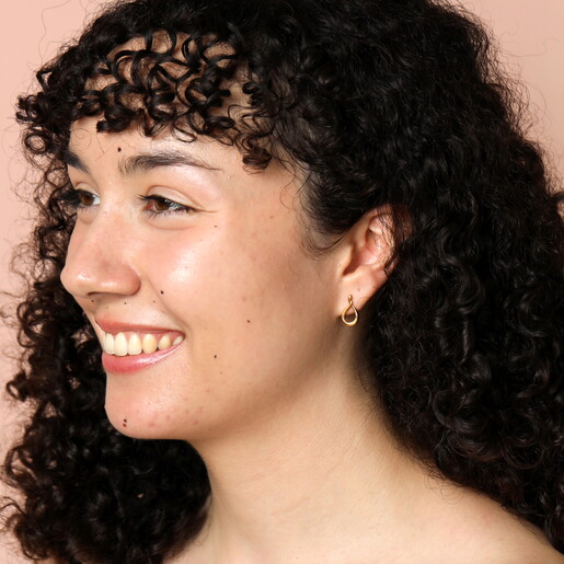 Model shot of Stainless Steel Infinity Stud Earrings in Gold