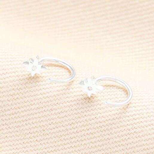 Close up of Sterling Silver Thread Through Star Huggie Hoop Earrings