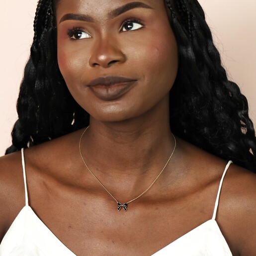 Black Enamel Bow Pendant Necklace in Gold on Model