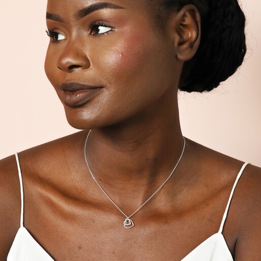 Model Wearing Sterling Silver Interlocking Crystal Heart Pendant Necklace