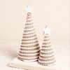 Matching pair of tree decoration on a neutral background