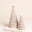 Matching pair of tree decoration on a neutral background