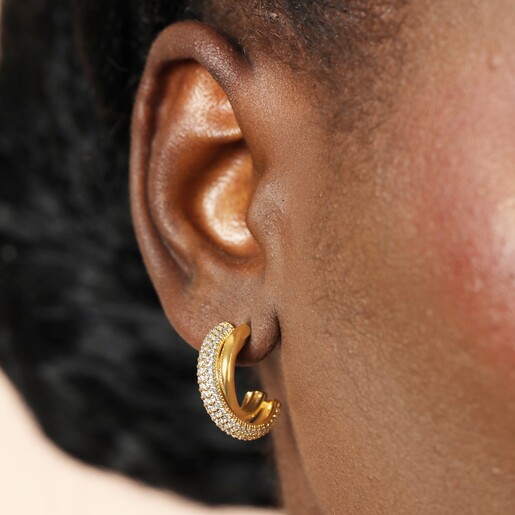 Model Wearing Crystal Interlocking Hoop Earrings in Gold