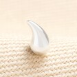 Close up of Stainless Steel Teardrop Piercing Earring in Silver on a neutral background