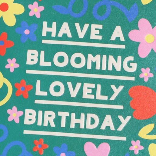Close Up of a Sweet Birthday Message on the Front of a Green Floral Card