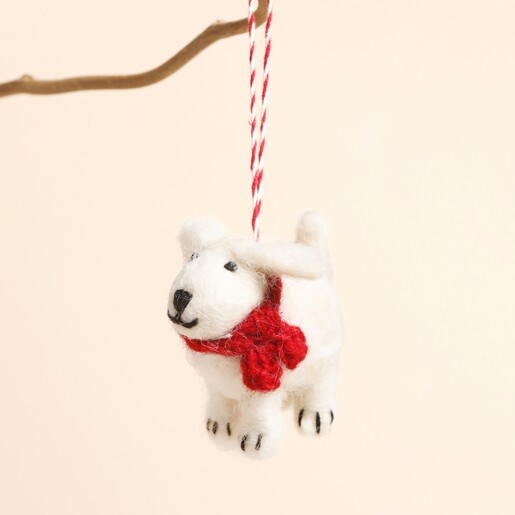 poodle hanging from branch