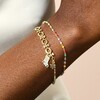 Model Wearing Double Layer Christmas Charm Bracelet in Gold
