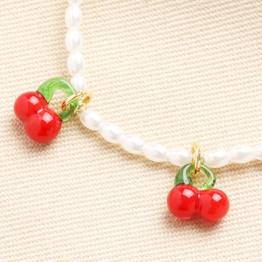 Close up of cherry charms on Pearl Cherry Beaded Charm Bracelet in Gold