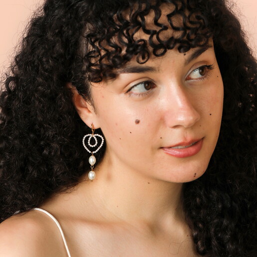 Stainless Steel Pearl Heart Huggie Drop Earrings in Gold on Model