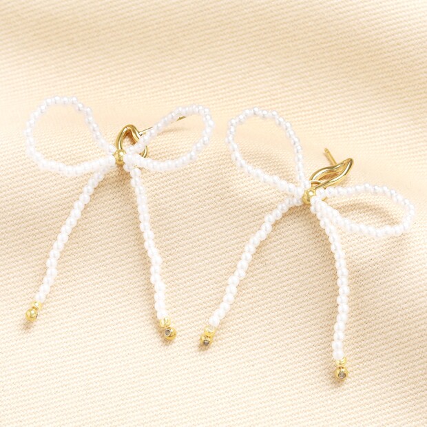 Stainless Steel Pearl Bow Stud Earrings in Gold Stainless Steel Pearl Bow Stud Earrings in Gold
