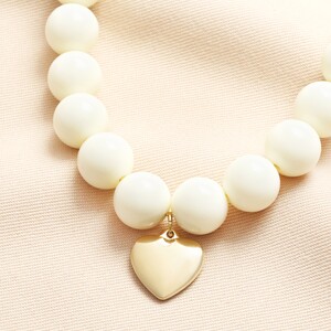 Cream Beaded Heart Charm Necklace in Gold