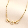 Triple Flower Barrel Chain Gold Necklace on a neutral background