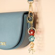 Pearl Flower and Bow Charm Keyring in Gold