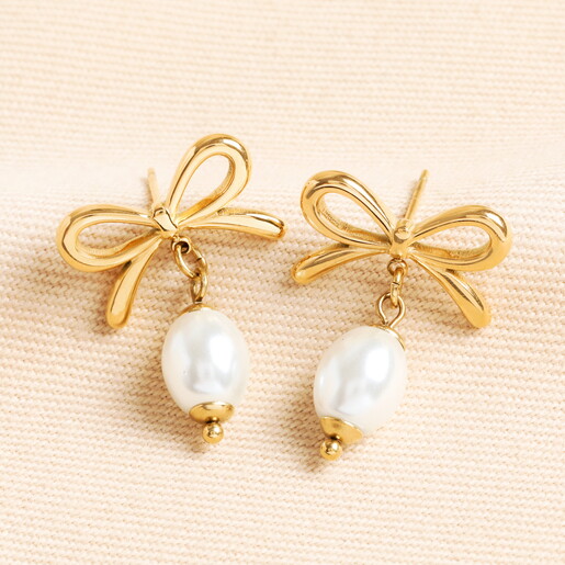 Stainless Steel Bow Pearl Drop Earrings in Gold