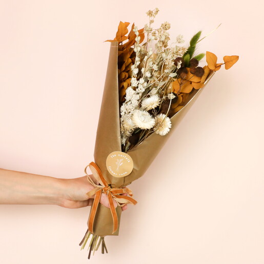 Model Holding Amber Autumn Market Dried Flower Bouquet