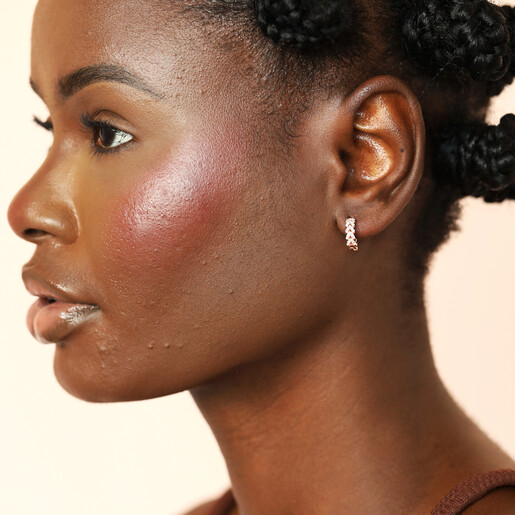 model shot of nature-inspired earrings in rose gold