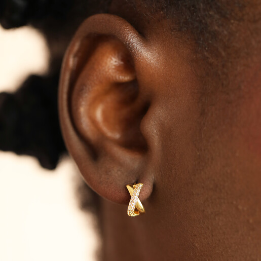 twisted earrings in gold on model