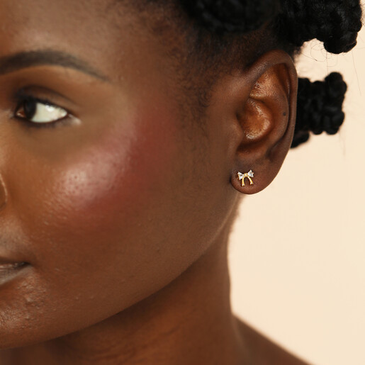 model shot of stud earrings in gold