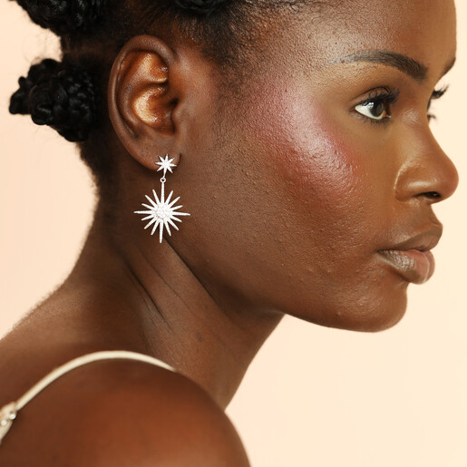 model shot of silver star shot earrings
