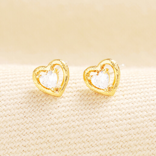 gold earrings in a heart outline shape