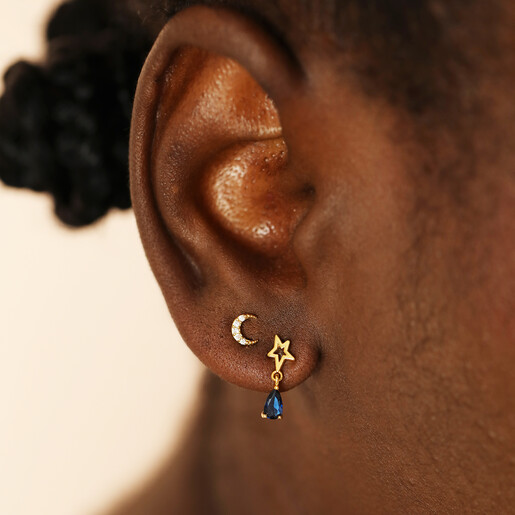 close up model shot of gold stud earrings