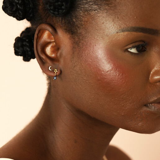 celestial earrings in gold on model