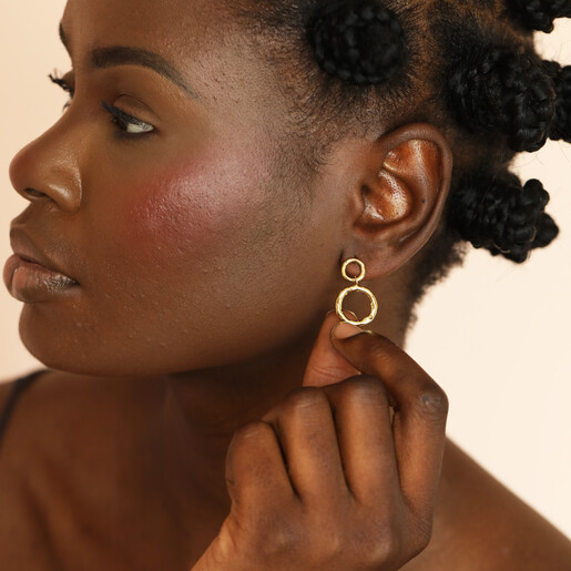 model shot of hammered earrings in gold