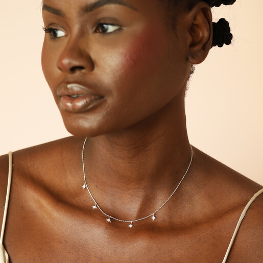 model shot of delicate charm necklace in silver