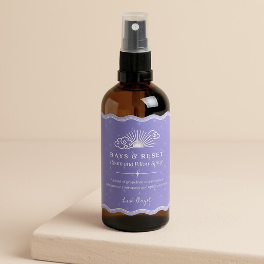 Amber bottle of Ray and Reset room and pillow spray with purple label.