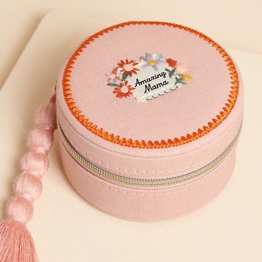 Close-up of the embroidered floral design and Amazing Mama lettering on the lid.