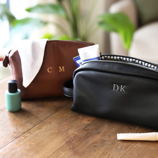 lifestyle shot of brown and black washbag