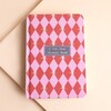 Front cover of the pink and red harlequin five year memory book
