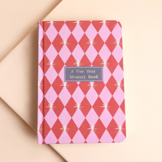 Front cover of the pink and red harlequin five year memory book