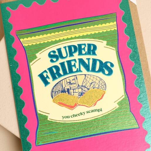 Close-up of Cath Tate Super Friends card showing shiny green scalloped border detail.