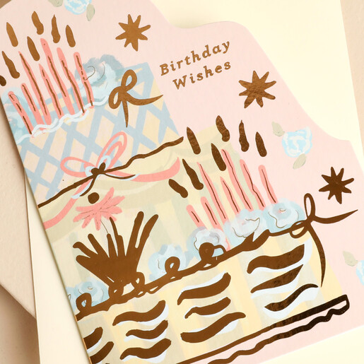 Close-up of the pastel birthday cake design with metallic gold stars
