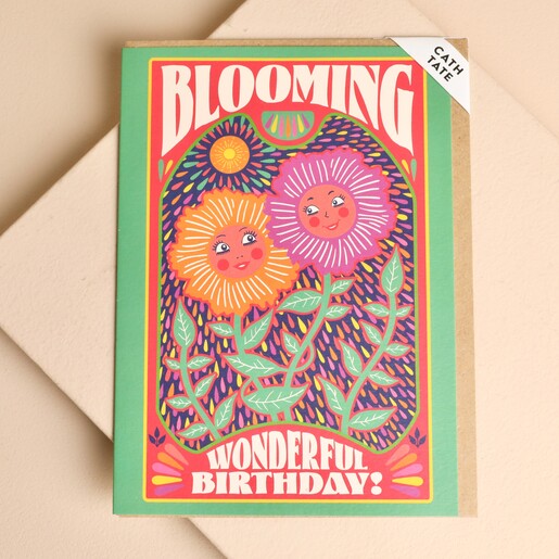 Retro Cath Tate birthday card featuring smiling flowers and a kraft envelope