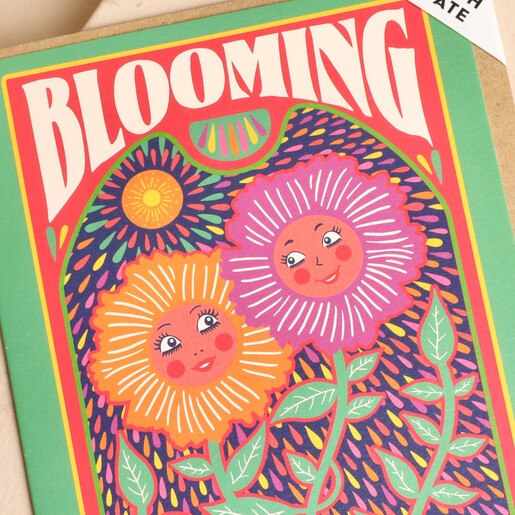Close-up of the retro smiling flower design reading Blooming Wonderful Birthday