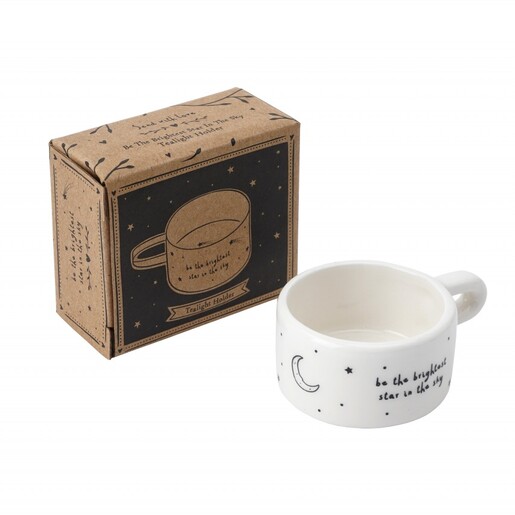 Ceramic tealight holder next to its illustrated kraft gift box