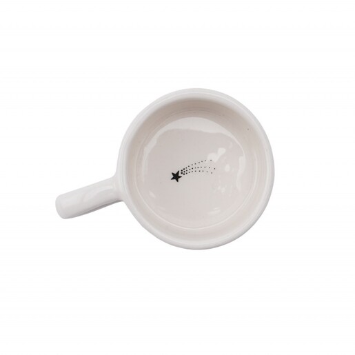 Top-down view inside the empty ceramic tealight holder showing shooting star detail