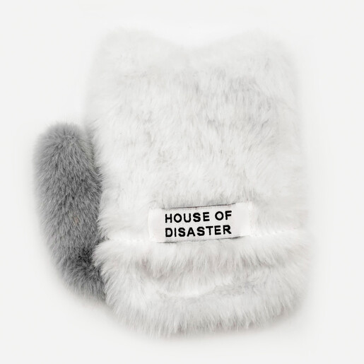 Back of the plush cat hand warmer showing House of Disaster fabric label