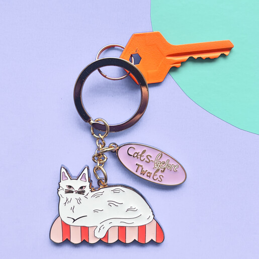 playful cats before twats keyring
